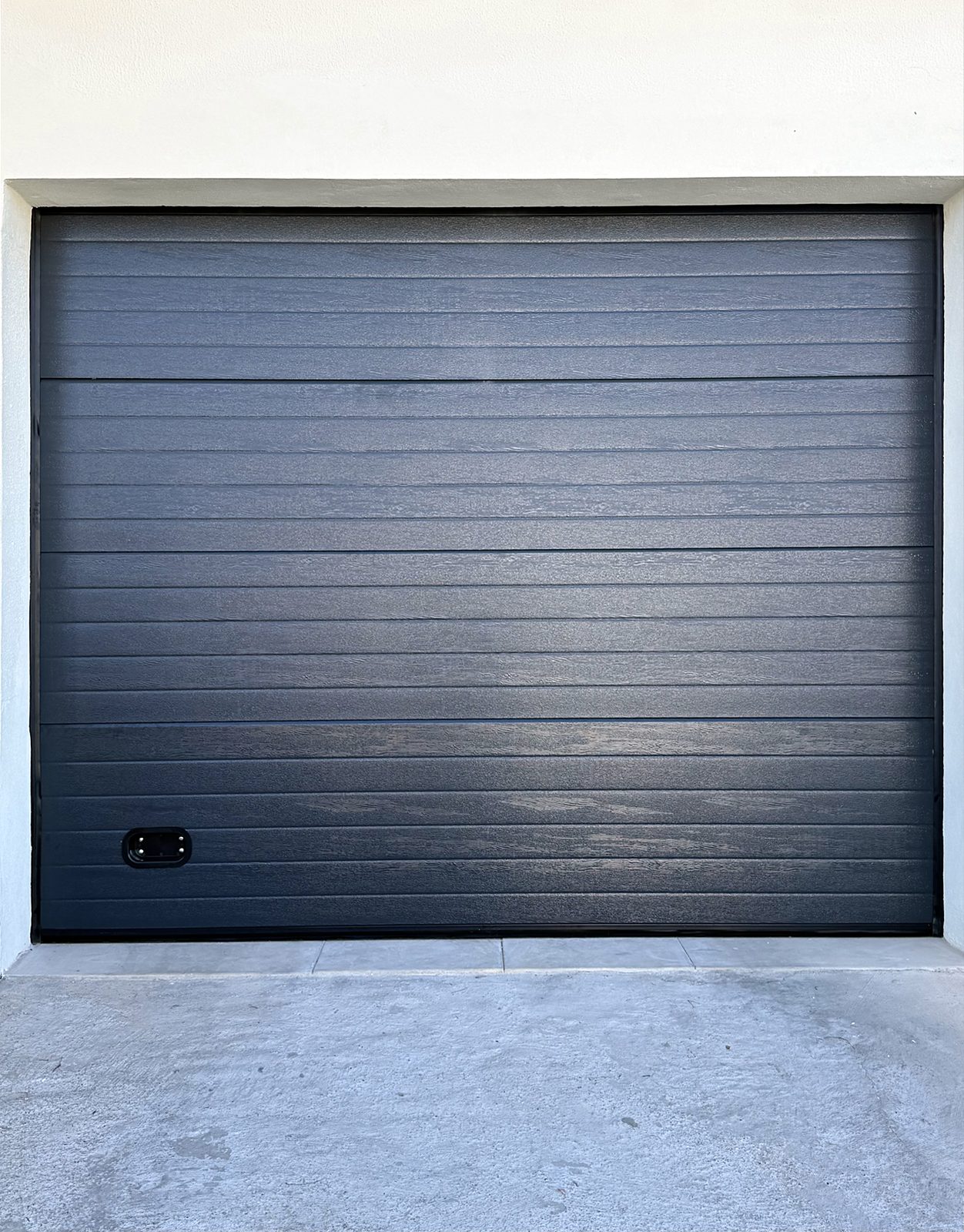 Porta seccionada antracite de garagem